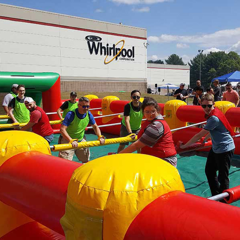 people playing giant human foosball