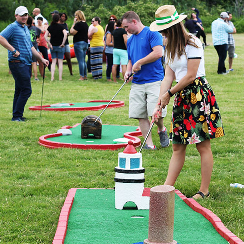 people playing outdoor mini golf