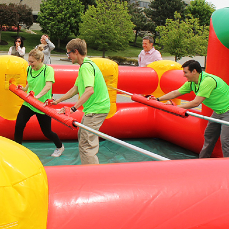 people playing giant human foosball