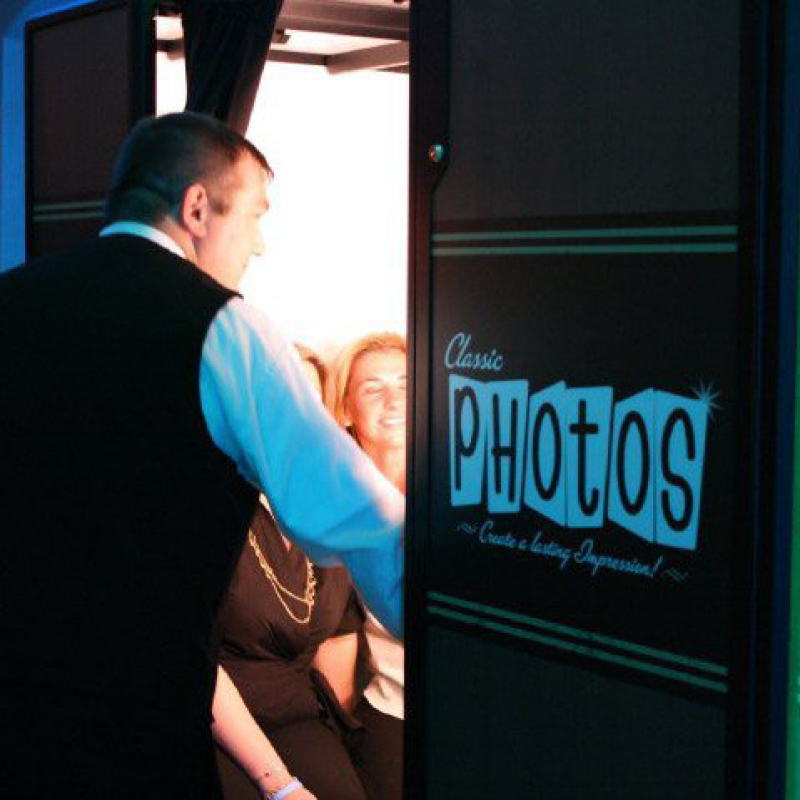 man checking on people in photobooth