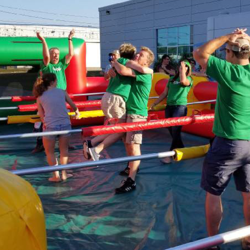 people playing giant human foosball