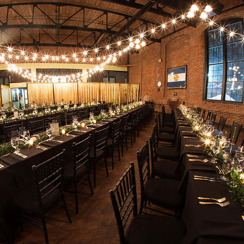 strings of lights draping above event tables