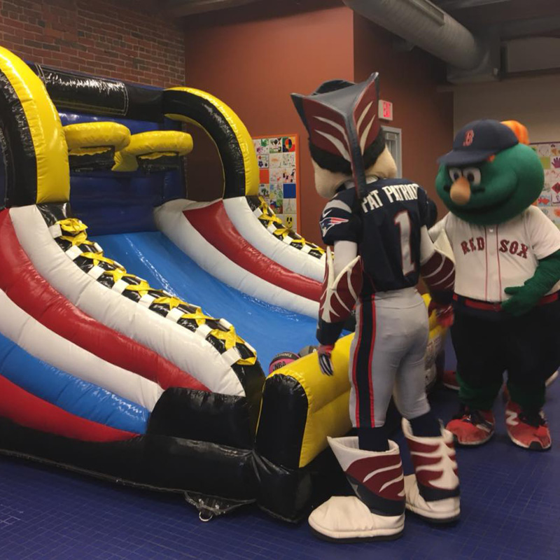 wally the green monster and pat patriot playing giant pop a shot
