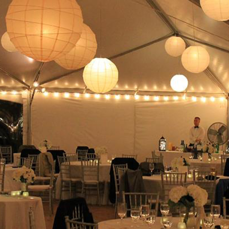 large paper lantern lights hanging in tent