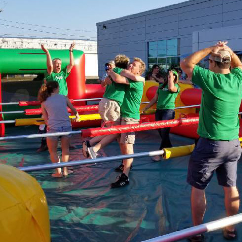 people playing giant foosball