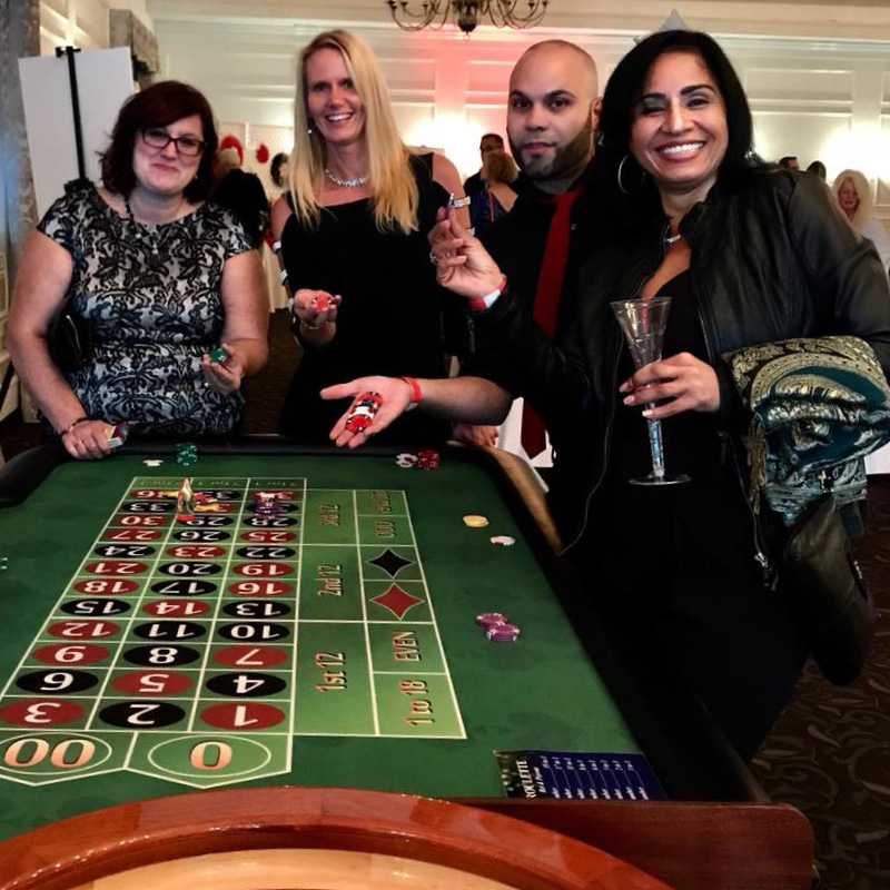 people at a roulette table