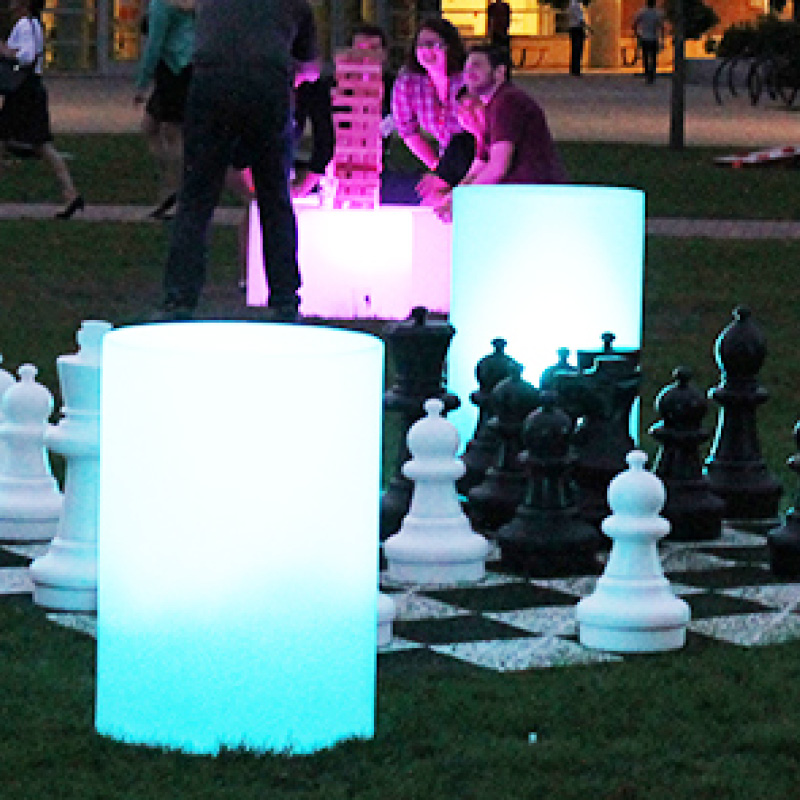 outdoor giant chess with illuminated furniture