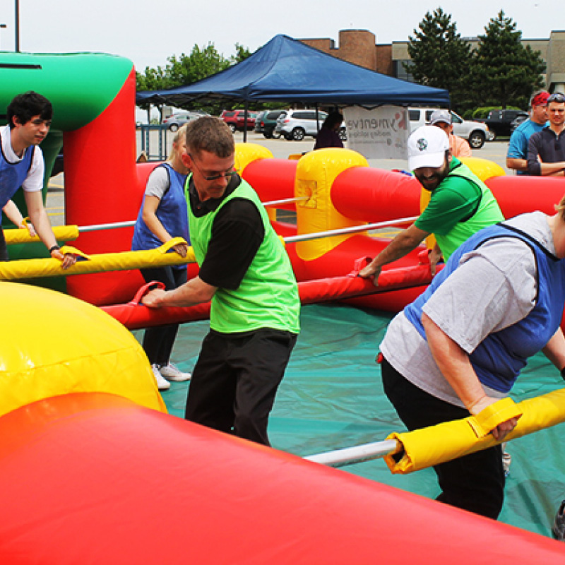 people playing giant foosball