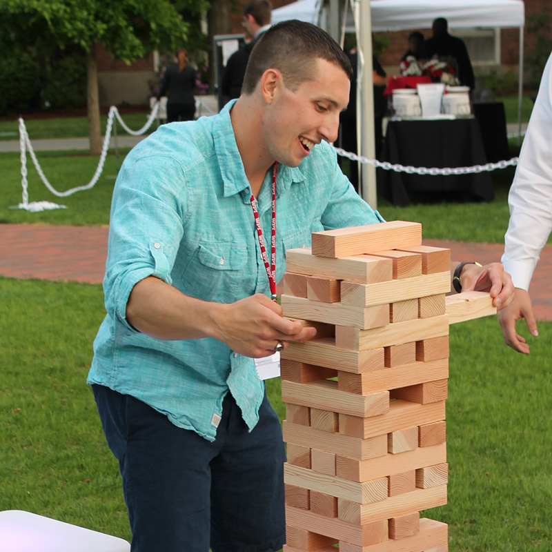 man playing giant jenga