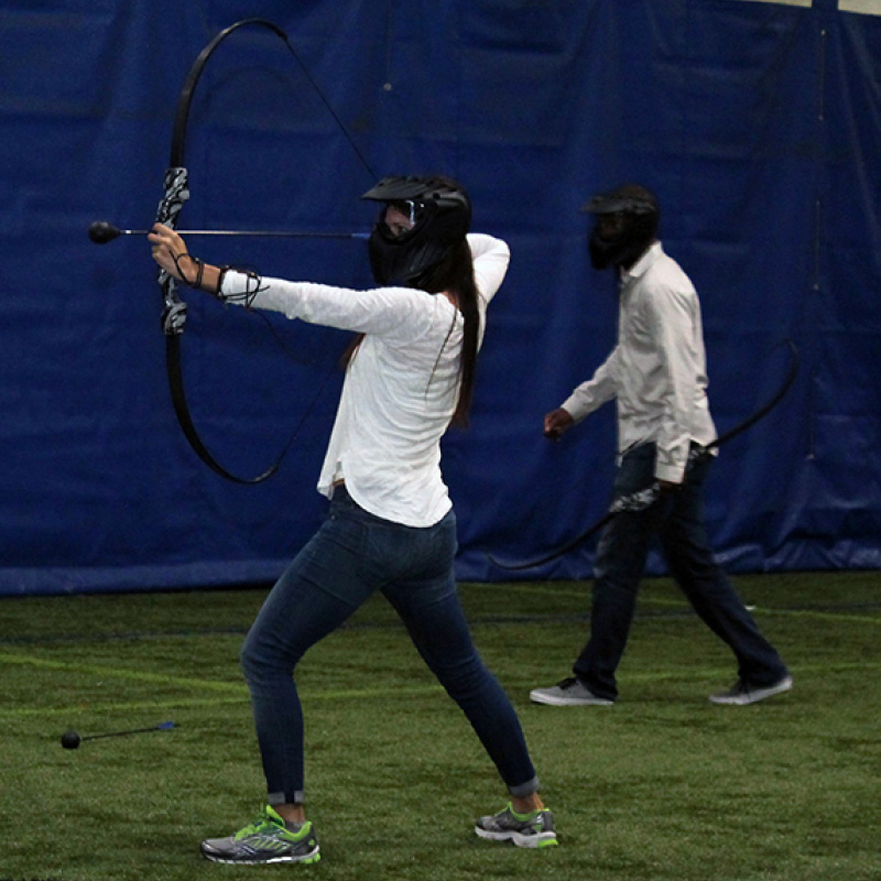 woman playing archery tag