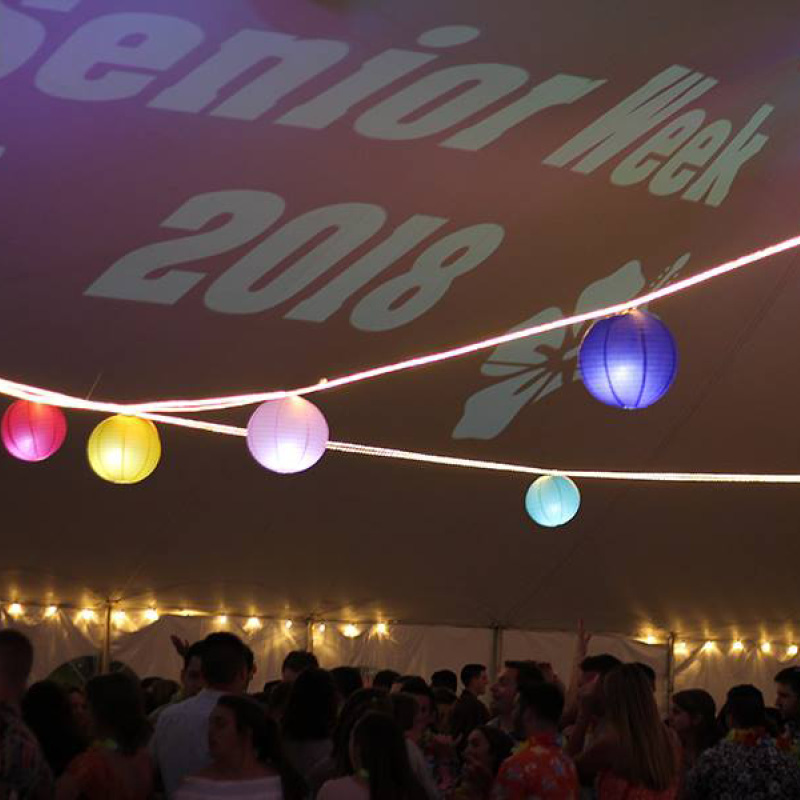 party name in lights on tent ceiling