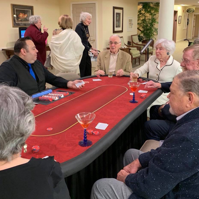 people sitting at a casino table