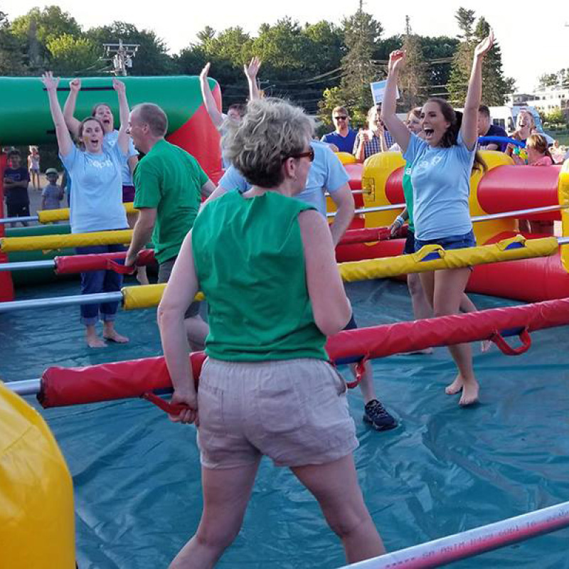 people playing giant foosball