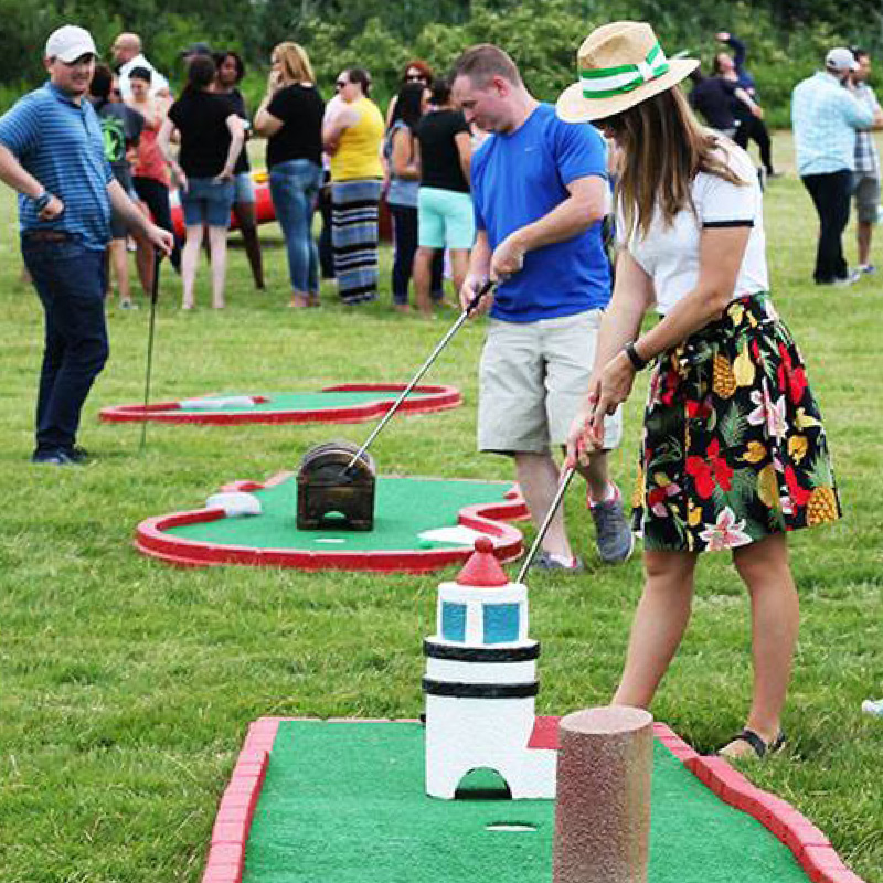 people playing outdoor mini golf