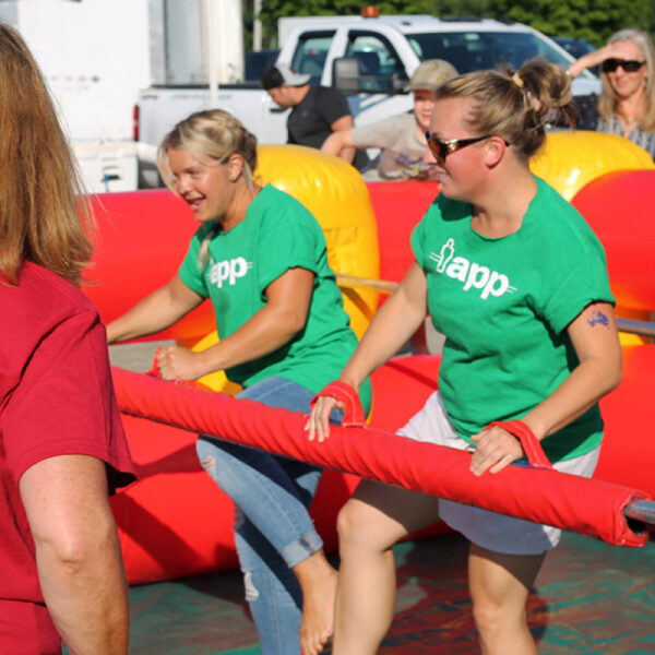 women playing giant human foosball