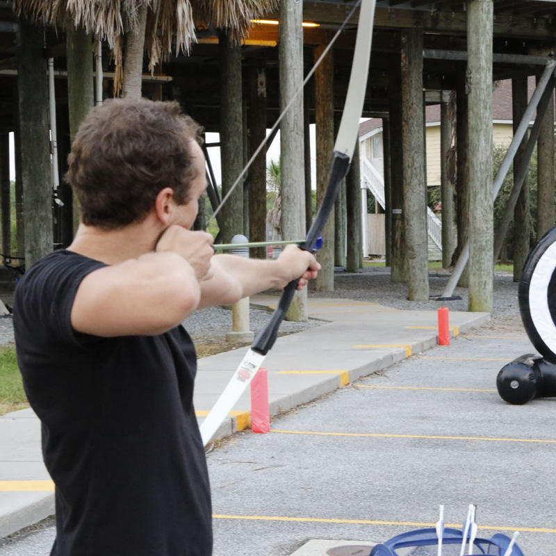 man at an archery station