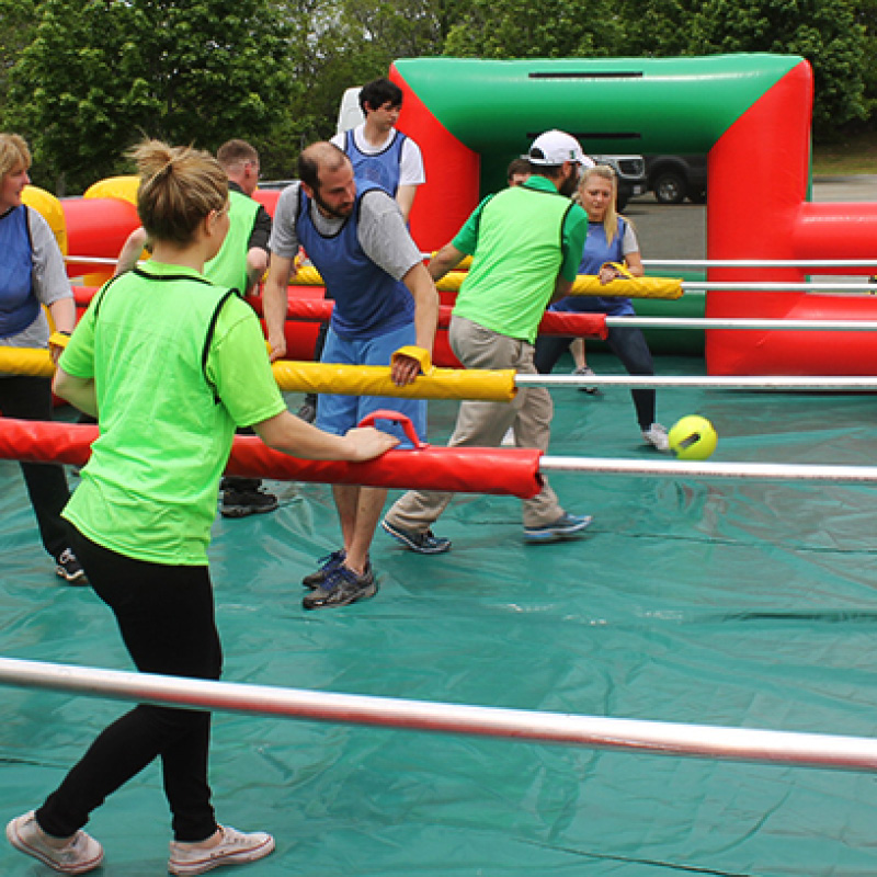 people playing giant human foosball