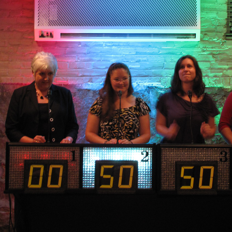 people playing game show mania