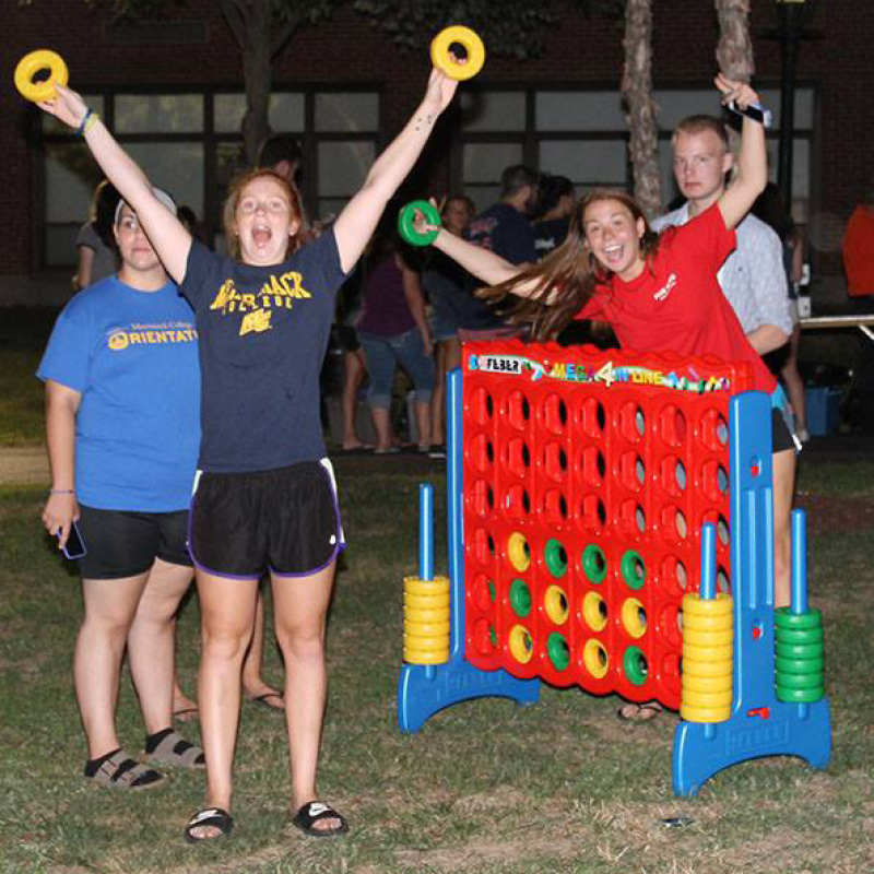 people playing giant connect four