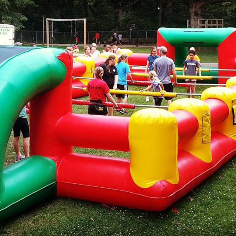 people playing giant foosball