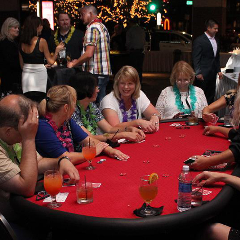 people sitting at a casino table