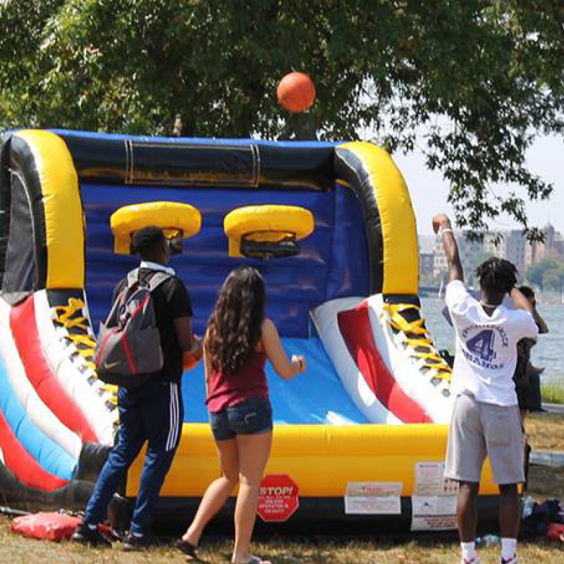 people playing the giant pop a shot game