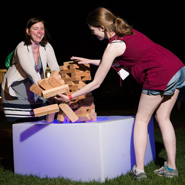 two women playing outdoor Jenga