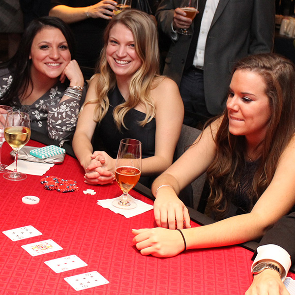 women sitting at a casino table