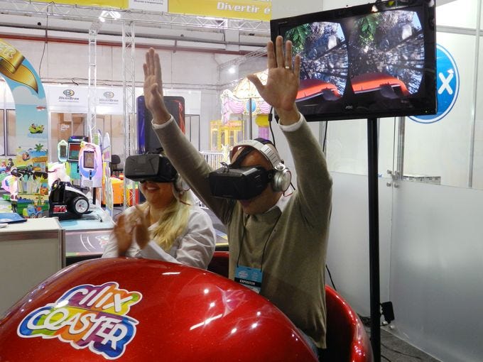 two people experiencing virtual reality roller coaster